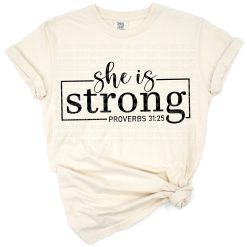 Uplifting phrase She Is Strong with modern feminine script and subtle religious design elements.