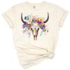 A watercolor painting of a longhorn bull skull with colorful country floral accents.
