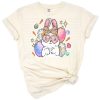 A playful bunny with pastel Easter eggs in a cheerful spring setting.