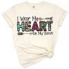 A playful illustration of hearts arranged along a sleeve with a romantic and cheerful vibe.