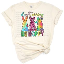 A cheerful western-style Easter bunny in a boho setting with playful holiday accents.