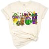Illustration of festive coffee cups with Mardi Gras masks and beads.