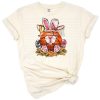 An Easter Bunny holding a basketball and baseball in a cheerful sports-themed illustration.