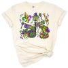 A festive Mardi Gras design featuring colorful text and decorative carnival mask graphics.