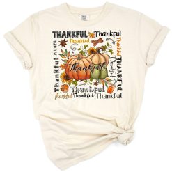 A hand lettered thankful typography with pumpkin in warm fall colors and autumn accents.
