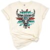 A boho Wild West skull design decorated with sunflowers, turquoise, serape patterns, and cowhide accents.