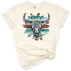 A boho Wild West skull design decorated with sunflowers, turquoise, serape patterns, and cowhide accents.