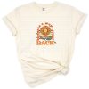 Retro groovy design with the phrase Kindness Always Comes Back in colorful vintage lettering.