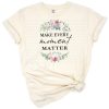 A bright floral arrangement with the words 'Make Every Moment Matter' in hand lettered script.