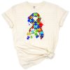 A colorful ribbon with interlocking puzzle pieces symbolizing autism awareness.