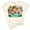 Cartoon safari animals including a giraffe in a playful western themed group.