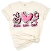 Three icons of peace sign, heart, and pink ribbon symbolizing breast cancer awareness.