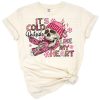 A retro-inspired skeleton holding a coffee cup with Valentine accents and a humorous quote.