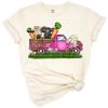 A cheerful vintage truck with a cow and bunny decorated for Easter festivities.