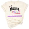 Playful Easter bunny and colorful eggs in a spring scene with a bunny trail.