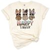 Three cute bunnies with leopard print patterns surrounded by Easter accents.