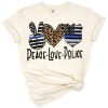 A grunge style design with peace sign, heart, and police themed graphics in blue and black.
