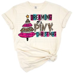 A retro pink Christmas tree with western flair and holiday accents.