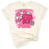 Retro style artwork with pink ribbon, football, and cheer theme for breast cancer awareness.