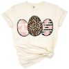 A trio of Easter eggs featuring blush florals, leopard cheetah print, and stylish stripes.