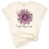 A pink ribbon with flowers and leopard print accents arranged in an inspirational design.