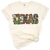 A western-style Texas state design featuring a cactus and sunflower in vibrant colors.