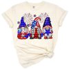 Three festive gnomes with red, white, and blue hats holding American flag hearts.