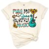 A western country scene with sunflowers, a guitar, and cowhide print accents.
