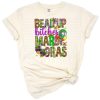 Western style Mardi Gras phrase artwork with colorful beads and a festive vibe.