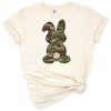 A beige camouflage bunny rabbit with Easter and springtime accents.