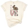 A bunny decorated with blush roses, leopard print, stripes, and floral elements for Easter.