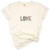 Patterned letters spell the word LOVE in a colorful and bold style, perfect for Mother’s Day shirts.