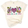 Three symbols in pastel colors featuring a peace sign, a heart, and an Easter bunny with festive accents