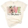 A retro western style illustration featuring the phrase 'Love Like Jesus' with Christian motifs and Easter accents.