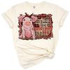 A cheerful pig wearing a Santa hat with a distressed western background for Christmas.