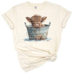 An adorable highland cow calf with floral accents in a playful cartoon style.