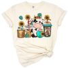 A whimsical illustration of a western-style cow surrounded by coffee cups with a rustic flair.
