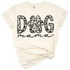 Hand lettered dog mama phrase with cute dog and decorative accents.