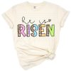 Decorative inspirational Easter artwork with He Is Risen text and festive accents.
