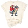 A cheerful cartoon T-rex dinosaur wearing a Santa hat, surrounded by festive Christmas decorations.