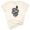 A black snake entwined with colorful flowers in a boho-inspired arrangement.