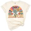 A retro-style rainbow with blooming flowers in a vintage color palette.