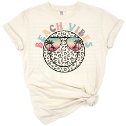 A retro style leopard print smiley face with beach vibes and summer elements.
