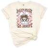 A groovy smiling bunny with Easter eggs and playful retro flowers.