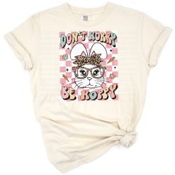 A groovy smiling bunny with Easter eggs and playful retro flowers.