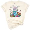 A cute bunny holding a festive coffee drink with Easter-themed decorations.