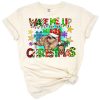 A cute sloth sleeping next to a decorated Christmas tree with festive accents.