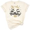 Illustration of bold lips, elegant eyes with lashes, and eyebrows in a birthday theme.