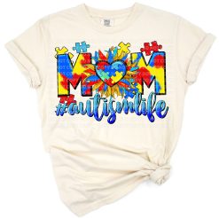 A western-style mom design with colorful autism puzzle hearts and bold accents.
