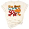 A playful illustration of a pumpkin pie slice with a dollop of whipped cream.
